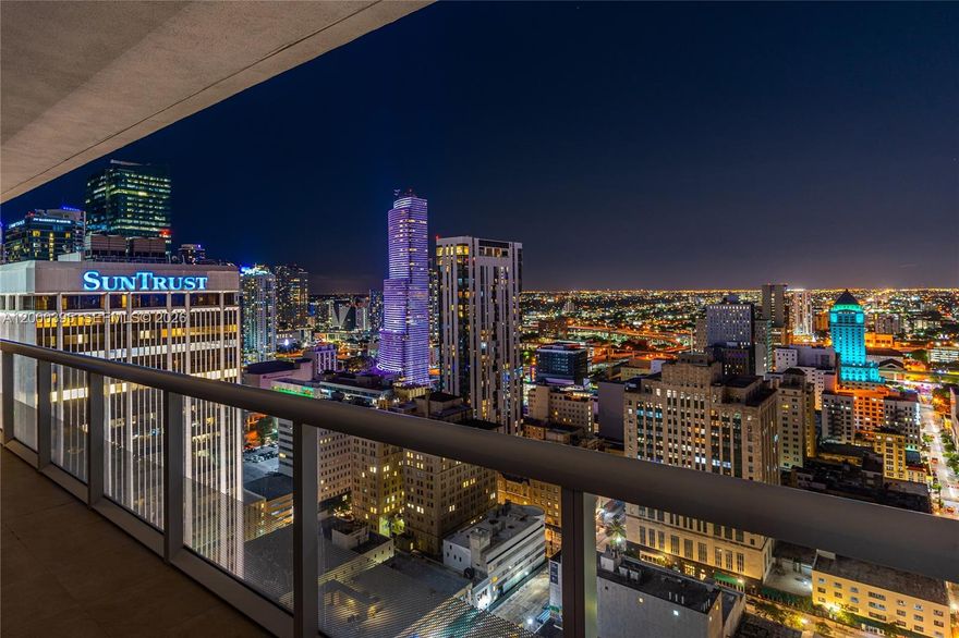 Experience refined Downtown Miami living in this sophisticated high-floor corner residence at the iconic 50 Biscayne. This home offers sweeping water and city views, a spacious split layout, and polished 32x32 high-end white porcelain floors. The sleek kitchen features Calacatta Italian marble surfaces with a waterfall island and premium cabinetry. Tasteful bathrooms include a jacuzzi tub and glass-enclosed shower. World-class amenities include a grand 3-story lobby, a 2-level club room with kitchen, billiards, a business center, and a heated Olympic infinity pool with cabanas and hot tub. Stay active in the 2-level fully equipped fitness and spa offering meditation and Pilates. Additional services include 24/7 concierge and security. Prime location steps from Whole Foods, Bayfront Park, Brickell Centre, museums, and fine dining. Beyond the immediate luxury of the unit itself, residents enjoy an unparalleled urban lifestyle where the vibrant energy of the city meets the serenity of the waterfront. The building's architectural significance is matched only by its proximity to the cultural heart of Miami. Whether you are hosting a formal gathering in the expansive club room or enjoying a quiet morning on your private balcony overlooking the bay, every detail of 50 Biscayne is designed to cater to a discerning lifestyle. This is a rare opportunity to own a piece of the skyline in one of the most sought-after addresses in the district, blending convenience, comfort, and style.