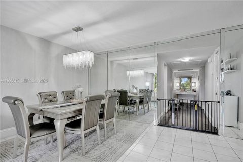 Photo of 2651 S Course Dr #410, Pompano Beach, FL 33069 (MLS # A11998675)