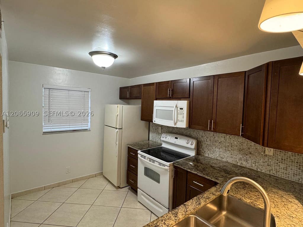 Photo of 3022 Coral Springs Dr #104-3, Coral Springs, FL 33065 (MLS # A12065909)