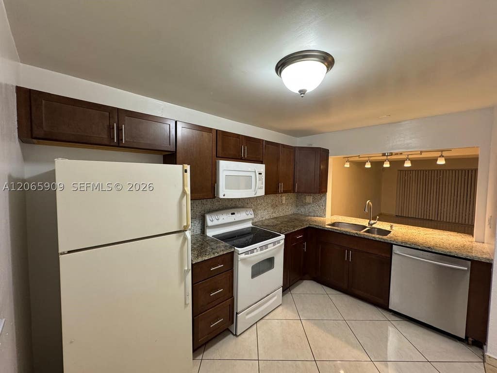 Photo of 3022 Coral Springs Dr #104-3, Coral Springs, FL 33065 (MLS # A12065909)