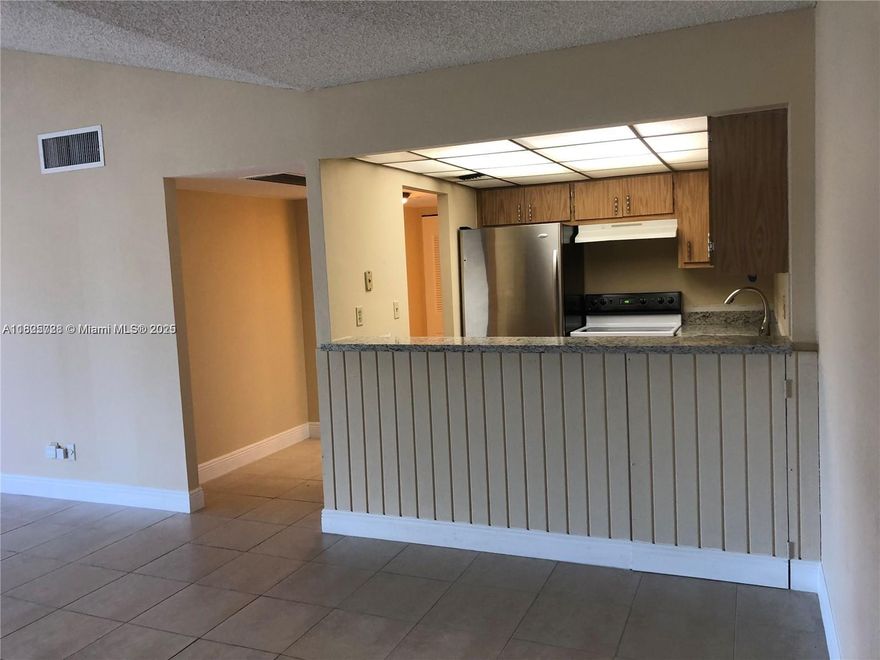 Great investment opportunity. Great long term tenant in place until August 3, 2025 paying $2,000 per month providing immediate income. This well-maintained 2/2 plus den features a functional layout with tile floors throughout living room and laminate flooring in bedrooms, a bright living area, and a private balcony. Centrally located near major highways, shopping, and schools. The community offers a pool, laundry facilities, and assigned parking. Low HOA. Don't miss out on this turnkey property with great potential in a convenient location.