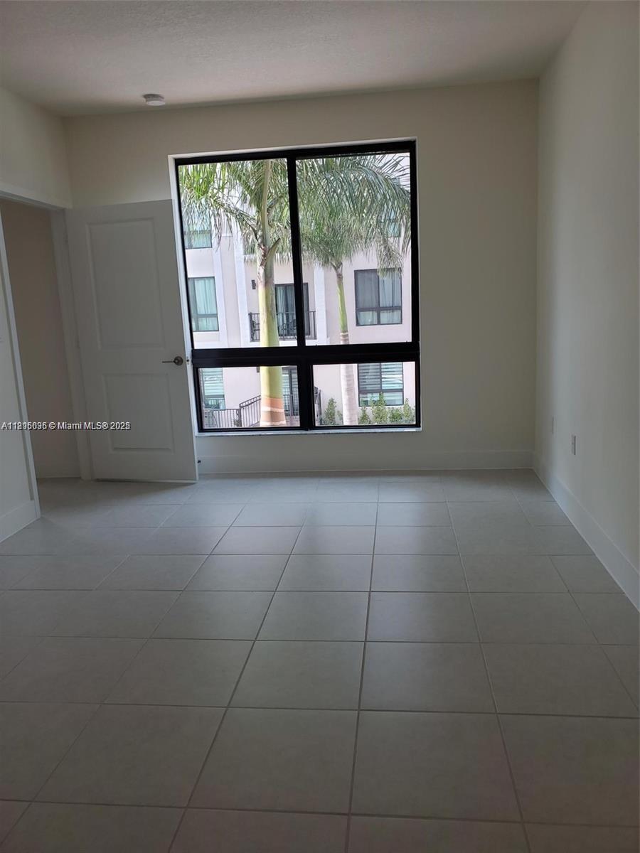 Located in the highly desirable Urbana community in Downtown Doral, this beautifully maintained 2-bedroom, 2.5-bath condo. The home features 1,124 square feet of thoughtfully designed space, including a sleek, modern kitchen, open-concept living and dining areas, and a private balcony perfect for enjoying the Florida breeze. Both bedrooms offer ample space and en-suite bathrooms, while the additional half bath is ideal for guests. The property is in excellent condition, move-in ready, and part of a vibrant, walkable neighborhood. Enjoy exclusive access to Urbana’s resort-style clubhouse, complete with a sparkling pool, state-of-the-art gym, indoor track, and more. All this, just steps away from world-class dining, shopping, parks, and top-rated schools in the heart of Downtown Doral!