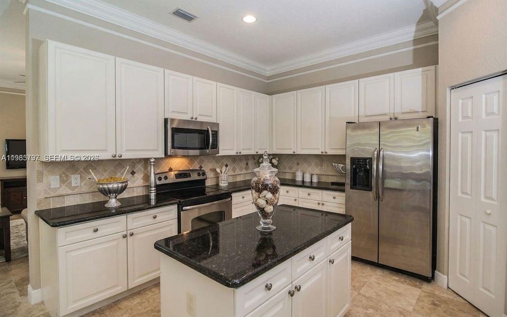 Photo of 1633 Victoria Pointe Ln, Weston, FL 33327 (MLS # A11985797)