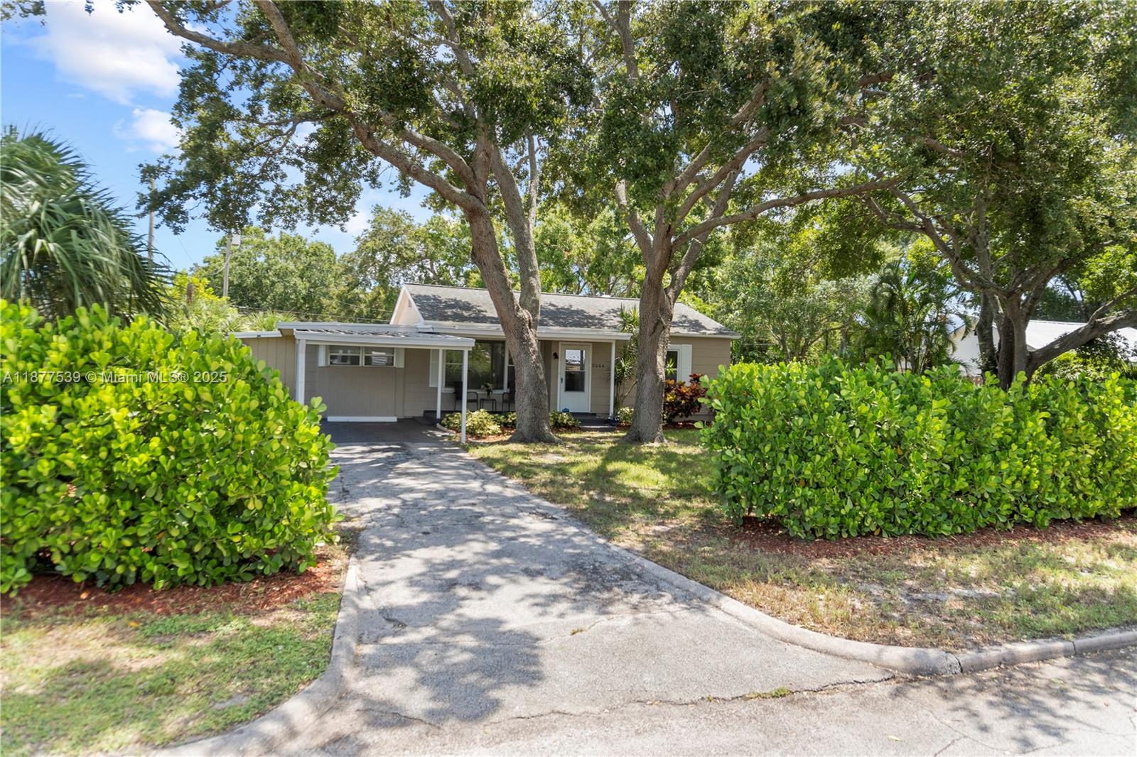 Location, Location, Location! NO HOA! This 1951 charmer is tucked away behind a lush 6+ foot Clusia hedge & fully fenced backyard, offering unmatched privacy. Nestled in the heart of the Historic District, you are near Vero Beach's downtown main street - restaurants, coffee shops, boutiques, & parks and only a 10-minute drive to the beach. Residential Multi-Family Zone. Inside, this well-maintained 3-bed, 2-bath home features a versatile room with private entry & rear parking, a screened back porch, numerous updates, and an outdoor storage shed. Offered partially furnished or unfurnished, the home provides flexible options to suit your needs. Located near Miracle Mile, shopping, beaches, and major highways, this property truly combines charm, comfort, and accessibility.
