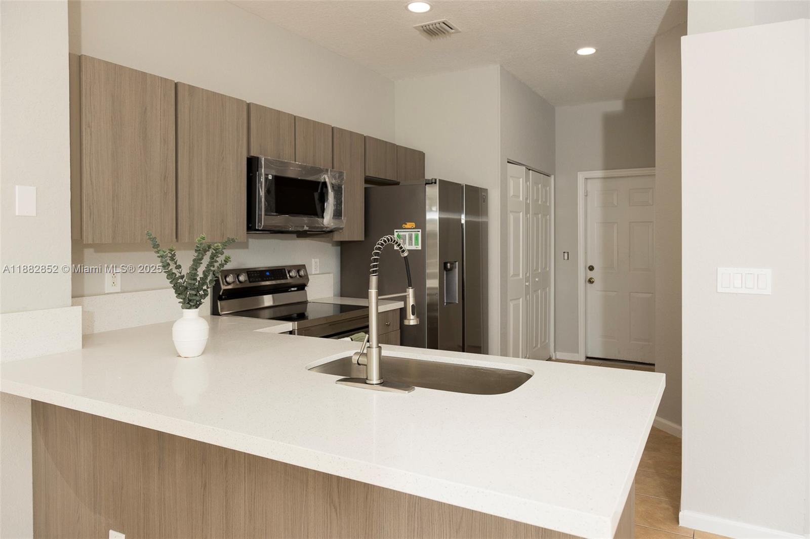 Beautifully renovated 3-bedroom, 2.5-bath townhome in a gated, peaceful community. The kitchen has been fully updated with new appliances, modern finishes, and ample storage. Enjoy serene lakefront views right from your backyard, perfect for relaxation. The spacious master bedroom offers a generous closet, plus additional storage throughout the home. Covered parking, washer & dryer in unit, and a community pool add convenience and comfort. Located just minutes from supermarkets, restaurants, and daily essentials. Two-week association approval and no minimum credit score required. Rare opportunity to lease in this small, quiet community—don’t miss it!