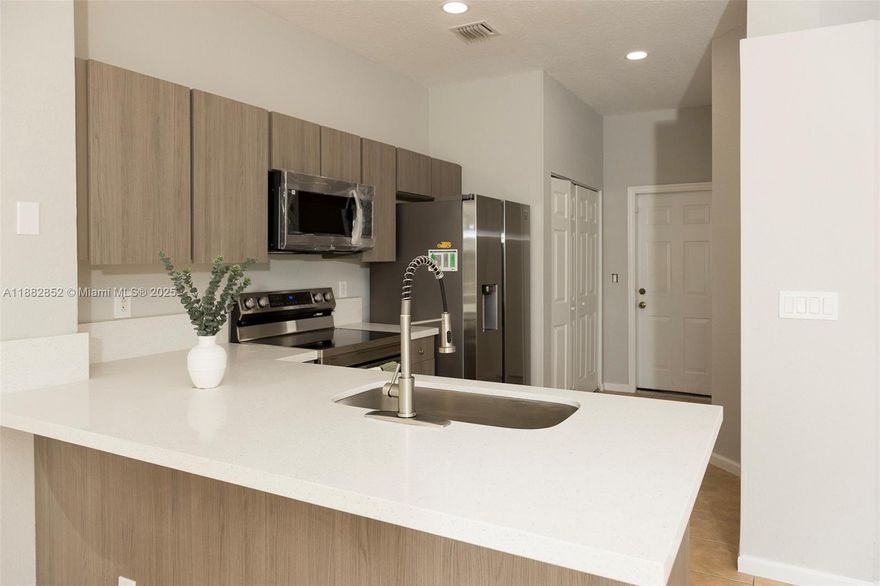 Beautifully renovated 3-bedroom, 2.5-bath townhome in a gated, peaceful community. The kitchen has been fully updated with new appliances, modern finishes, and ample storage. Enjoy serene lakefront views right from your backyard, perfect for relaxation. The spacious master bedroom offers a generous closet, plus additional storage throughout the home. Covered parking, washer & dryer in unit, and a community pool add convenience and comfort. Located just minutes from supermarkets, restaurants, and daily essentials. Two-week association approval and no minimum credit score required. Rare opportunity to lease in this small, quiet community—don’t miss it!
