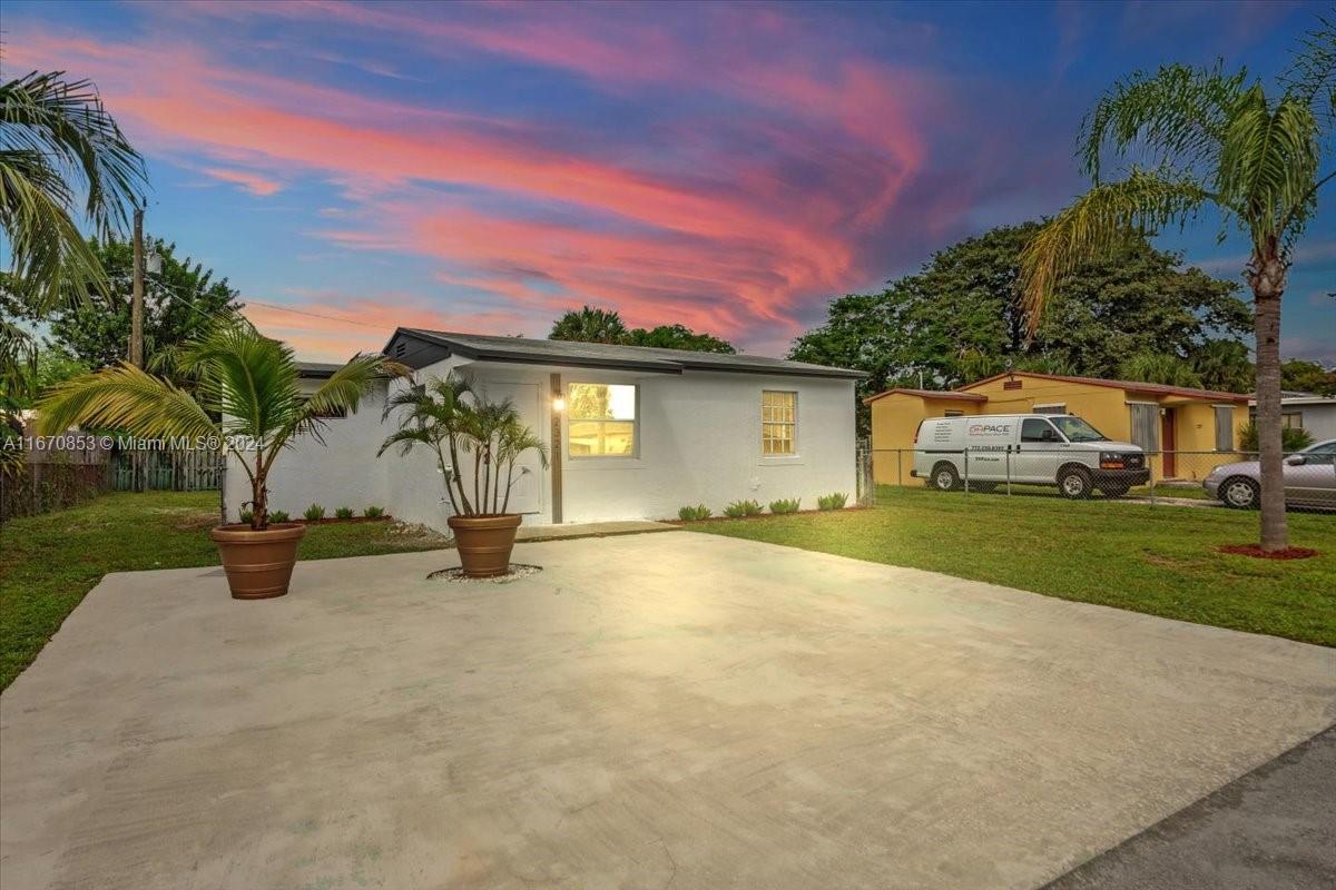 Welcome to your dream home! This freshly renovated 2-bedroom, 1-bathroom residence boasts a spacious backyard, perfect for outdoor gatherings or a serene retreat. The inviting lawn surrounds the house, enhancing its curb appeal and providing a delightful space for children or pets to play. Convenient driveway parking adds to the ease of living. Inside, the abundance of windows floods the rooms with natural light, creating a warm and welcoming atmosphere. The crisp white walls beautifully enhance the brightness, making every space feel open and airy. Whether you're enjoying a cozy evening in the living room or entertaining in the dining area, this home offers comfort and style in a fantastic setting. Don’t miss the chance to make it yours!