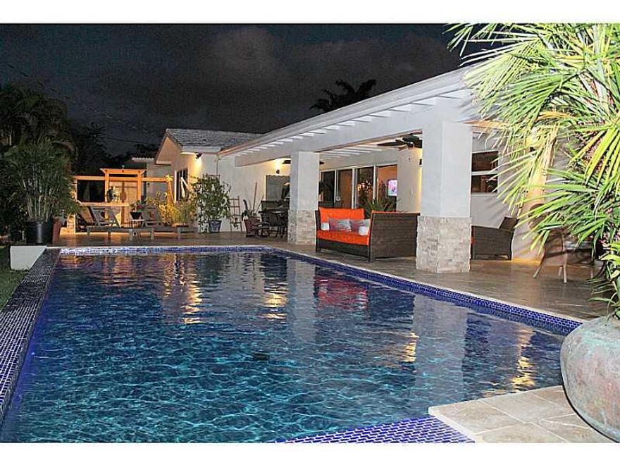 This is THE one! Extremely unique, Miami Shores Modern Masterpiece! Zen inspired courtyard entrance with Koi pond and tropical landscape. Brilliant, totally renovated, designer home. Fabulous open spaces both inside and out. Terrazzo flooring, Gourmet kit chen with all Thermador appliances including induction cook top. Sprawling master suite, amazing bathrooms, impact windows and doors and a private pool /patio living area that with take your breath away!  Enjoy South Florida's lifestyle to the max!