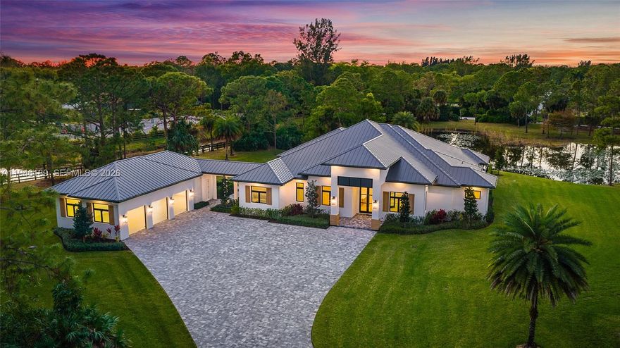 Set across 6.51 acres within a private estate community of spacious homesites and custom residences, this newly built home offers privacy, scale, and presence. The home features a modern floor plan with a clean, timeless design. Multiple interior spaces flow to a large covered and open-air outdoor patio with a summer kitchen, built-in speakers, and a heated saltwater pool & spa for seamless indoor-outdoor living. The rear grounds overlook a tranquil pond, with plenty of surrounding green space. A detached four-bay garage with lift-height ceilings connects via breezeway. Flexible for a full equestrian estate or private retreat, the property also allows for a guest quarters or private office. Short hacking distance to the 30-acre community equestrian park, 32 miles of bridle trails,