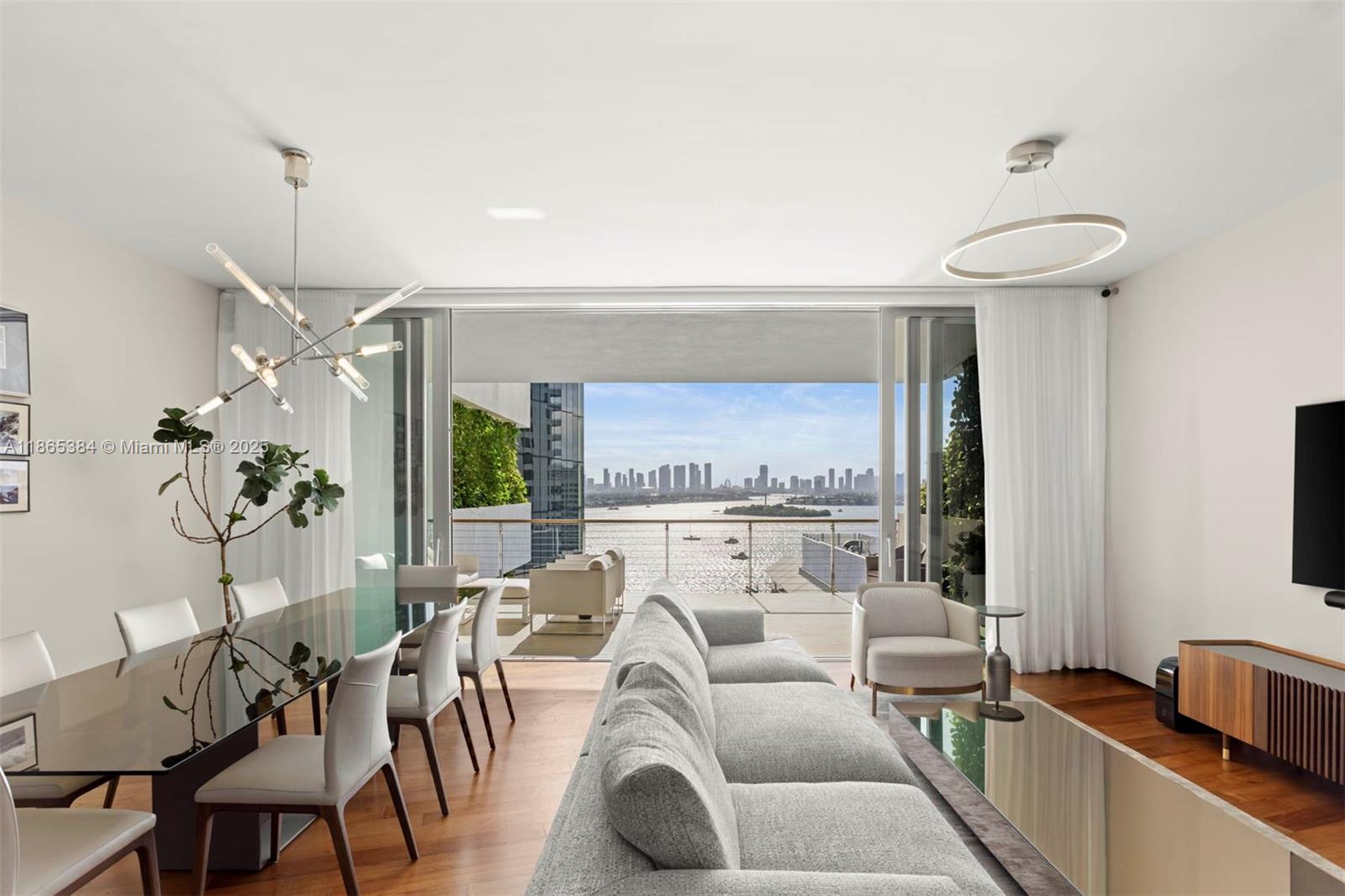 Discover refined living at Monad Terrace, a design-forward building envisioned by acclaimed architect Jean Nouvel. With only 59 residences, this boutique waterfront development offers unmatched privacy, security, and prestige in the heart of South Beach's residential West Avenue enclave. This flow-through 2 bedroom, 2.5 bath residence features two expansive terraces, capturing stunning sunrises over the Atlantic Ocean and breathtaking sunset views across the Miami skyline. The seamless indoor-outdoor layout offers a connection to nature without sacrificing views. Finished with elegant materials, the home includes a flex area, great for a home office. Two parking spaces included. Monad residents enjoy world-class amenities, privacy and service steps away from dining, shops and more.