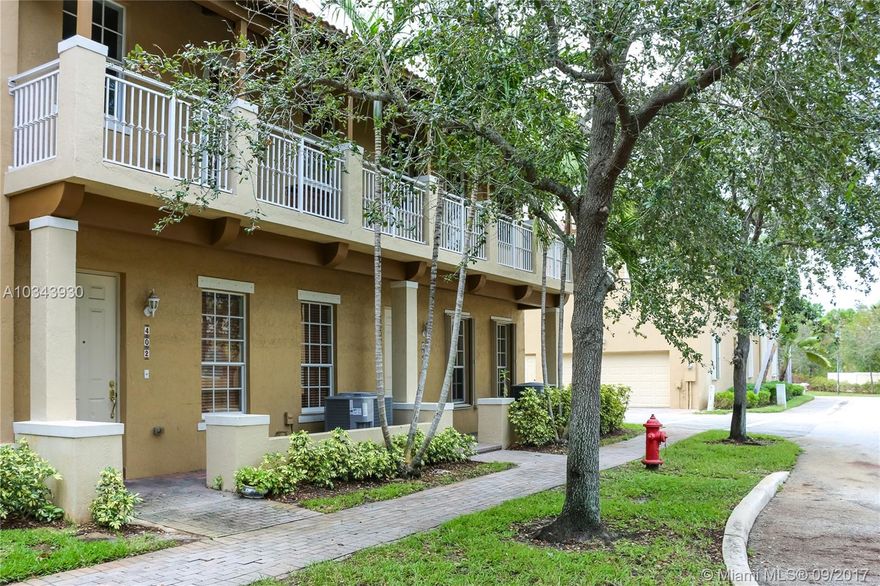 Stunning two story townhouse with 3 Bedrooms, 3 Baths and 2 Car Garage in coveted Canterbury Quantum. Features include entryway with grand staircase with vaulted ceilings lead you into an open floor plan. Entertainers kitchen with upgraded cabinetry, breakfast bar and newer appliances. Bedroom & full bath on first floor for easy access to main living areas. Private enclosed patio area. Second floor accesses oversized loft and private covered balcony. Master bed features walk-in closet and ensuite bath. Bonus: New a/c, water heater and w/d in this unit! Hurricane shutters, gated community, pet friendly with pool.Low HOA and walk to Publix Plaza.