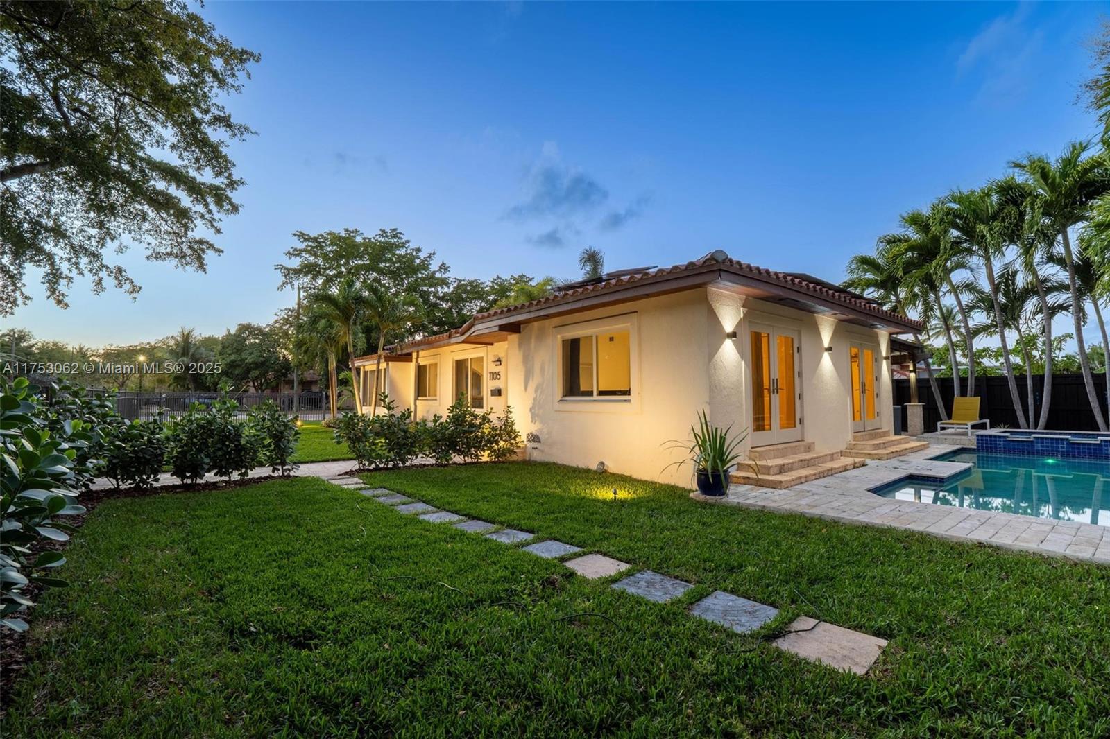 Welcome to Villa Robles! If you’re looking for a beautifully updated three bed-two bath gated-fenced corner lot pool home compound retreat, then this house is a MUST SEE! Enter into the light bright great room, complete with hardwood floors, plus a bonus sun-drenched den with gorgeous travertine marble floors and a sleek updated modern designer kitchen. Enjoy resort-like amenities in the lush rear and side gardens, with a sparkling spa-like water feature pool, a covered pergola dining and entertainment deck and bountiful green grassy areas for relaxation and play. Great features: impact windows and doors; new solar panels; updated electrical; and renovated kitchen and baths. All in a fantastic North Miami location close to shopping, dining and cultural hotspots. Your new dream home awaits!