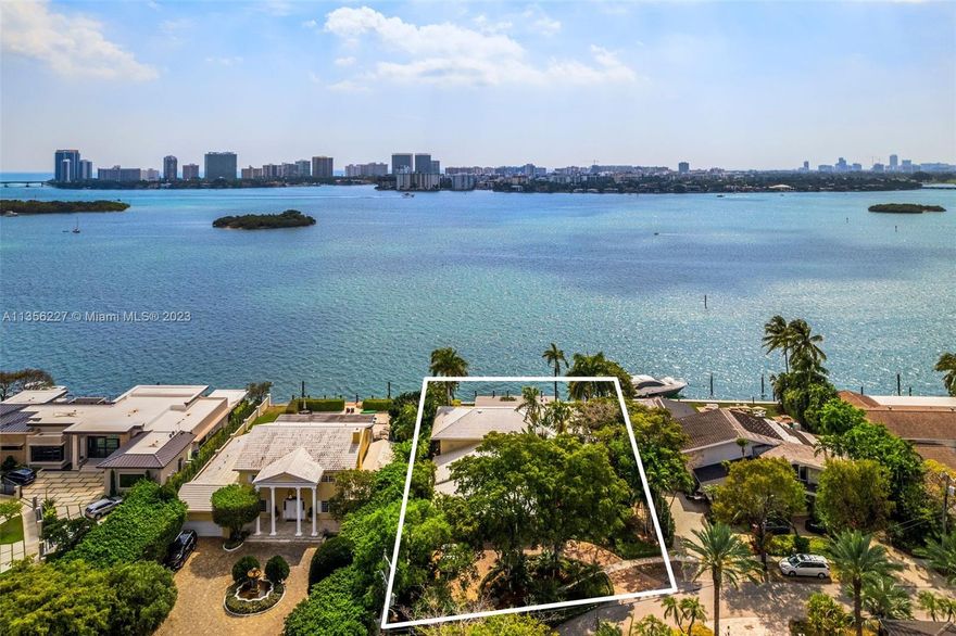 Located in the gated waterfront community of Keystone Islands, this oversized 17,896 SF lot boasts 103 FT of water frontage, with spectacular east facing wide bay views. Build your dream or renovate this spacious 4-bed + office two story home, with an open floor plan, bright rooms, large pool, and lush landscaped gated entry area.  Enjoy views of Biscayne Bay, Bay Harbor, Bal Harbour, and the Sunny Isles skyline. Imagine waking up to breathtaking sunrises every morning from your waterfront residence. Located on a quiet cul-de-sac, this property is a boater's dream with a 50 ft private dock, deep water dockage and no fixed bridges.