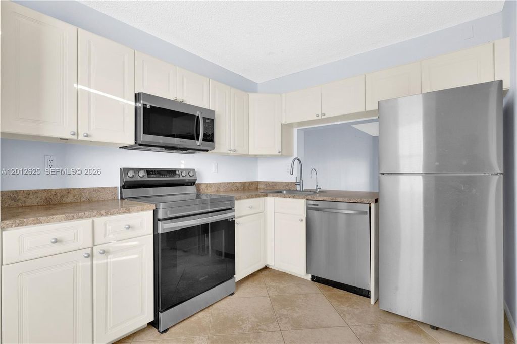 Photo of 3050 NW 42nd Ave #C406, Coconut Creek, FL 33066 (MLS # A12012625)