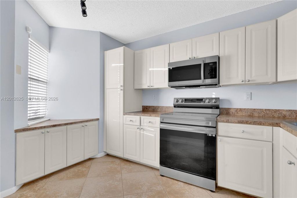Photo of 3050 NW 42nd Ave #C406, Coconut Creek, FL 33066 (MLS # A12012625)