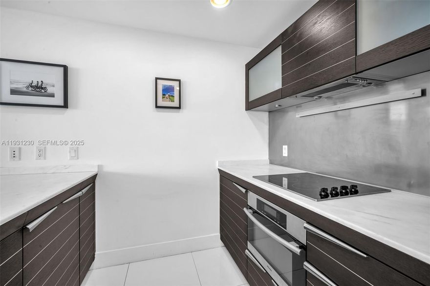 Discover elevated luxury in this 1-bedroom, 1.5-bath penthouse on the 40th floor of Epic, one of Miami’s most exclusive addresses. Featuring top-tier finishes throughout, the residence offers a Snaidero kitchen with Miele appliances, a Sub-Zero refrigerator, Italian flooring, marble bathrooms, custom closets, and a 178-sq-ft balcony with sweeping 180° panoramic city views. Enjoy VIP access to Joia Beach Club, 15% discounts at Zuma, Hell’s Kitchen, and Novikov, complimentary tickets to Silverspot Cinema, as well as spa services, in-room dining, and resort-style pools. Just steps from Whole Foods and Brickell City Center. Schedule your private showing today.