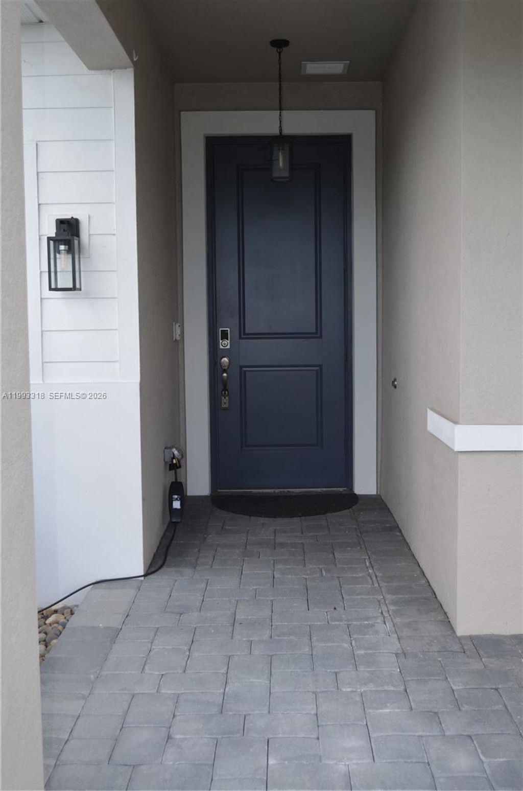 Photo of 6448 NW Cloverdale Ave, Port St Lucie, FL 34987 (MLS # A11993318)