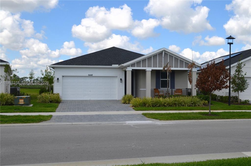 Photo of 6448 NW Cloverdale Ave, Port St Lucie, FL 34987 (MLS # A11993318)