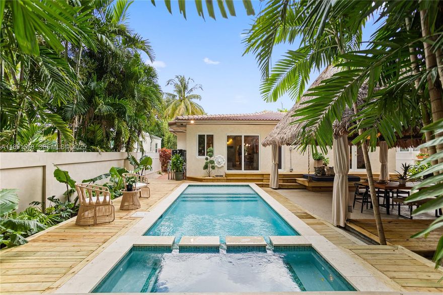 Escape the fast pace of Miami in this Bali-inspired tropical retreat located in Shorecrest, just minutes from Miami Shores and North Bayshore Park. Featuring a new pool with deck, in-ground jacuzzi, outdoor cold plunge & soaking tub under the palms, Tiki lounge area, and zoning for short-term rentals. This fully renovated 3-bed, 3-bath home features one suite with a private entrance and bathroom, plus a spacious den that can easily be converted into another bedroom. The property has all-new plumbing, electrical, ceilings, and walls, as well as impact doors and windows — all with closed permits. Enjoy low Miami-Dade taxes, serene outdoor spaces, and the perfect blend of design, comfort, and investment potential. Furniture and decoration shown in photos available separately.