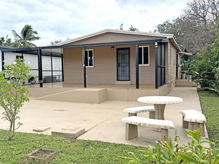 This 3-bedroom, 2-bathroom home offers approximately 1,150SqFt of comfortable living space. The open kitchen flows seamlessly into the living area, creating a bright and inviting layout enhanced by natural light from multiple windows throughout the home. Tile flooring extends throughout, including both bathrooms, and impact windows provide added security and peace of mind. The spacious backyard with fruit trees offers a relaxing outdoor setting, while the in-home washer and dryer add everyday convenience. Conveniently located near shopping, dining, and local amenities, this home is move-in ready. Schedule your showing today.