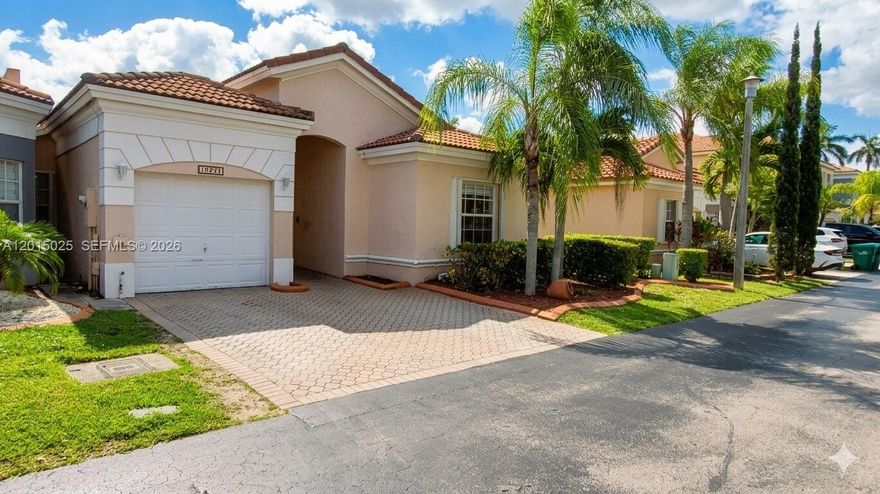 Step into this stunning one-story corner townhome, perfectly situated in the sought-after Forest Lakes community. This prime location offers the ultimate convenience, placed within walking distance to West Kendall Baptist Hospital and just minutes from supermarkets and premium shopping. Inside, a bright, open-concept design meets sophisticated modern living. Featuring 3 spacious bedrooms and 2 bathrooms, the home is defined by soaring vaulted ceilings and oversized windows that bathe every room in natural light. The property feels brand new and modern, boasting a fully remodeled kitchen and two beautifully updated bathrooms. With easy-to-clean tile floors throughout and a thoughtful layout, the home offers plenty of space and privacy for everyone. Whether you're enjoying a quiet evening in the cozy family room or hosting a dinner in the formal dining area, this space is built for versatility and comfort.