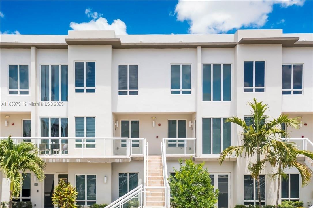 Discover this stunning condo in Landmark at Doral, designed for those who value style, comfort, and a prime location. The first floor features an open-concept social area, a sleek kitchen with stainless steel appliances, wine cooler, white cabinetry, and quartz countertops. Enjoy resort-style amenities including a clubhouse, swimming pool, gym, party room, BBQ area, kids pool, tennis courts, open-air amphitheater, and 24/7 security. The home also includes a covered garage and guest parking. Modern, functional, and move-in ready your next home is waiting. This charming fenced yard ensures a safe and comfortable space where your family can relax and create lasting memories.