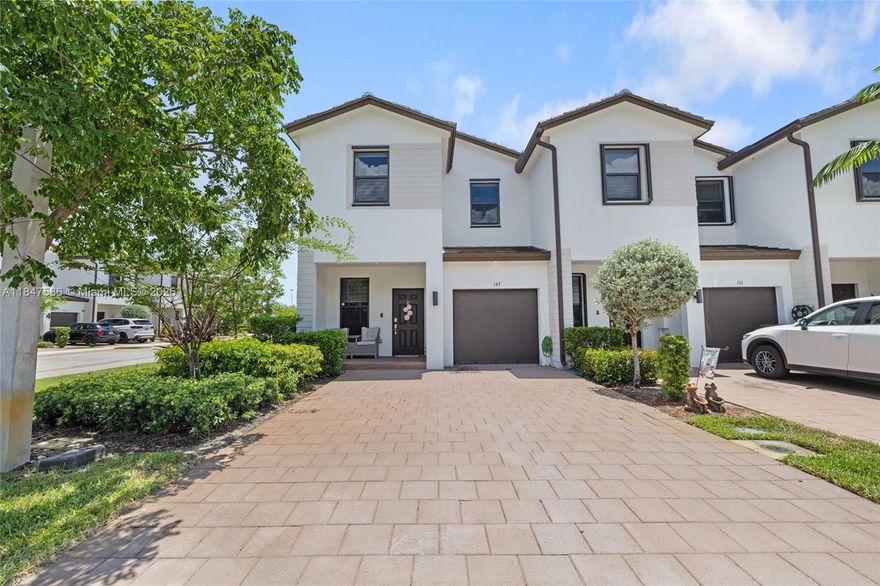 Corner Unit in Tuscan Pines! This 4-bedroom, 2.5-bath Lennar-built townhouse offers a perfect blend of style and convenience. The open-concept kitchen and living area feature stainless steel appliances, white marble countertops, and an elegant backsplash. Tasteful wood-look vinyl floors flow throughout, complemented by updated bathroom vanities. The primary suite includes dual sinks and a glass-enclosed shower. EV charger installed for easy access to a charging station. Enjoy a private backyard space, one-car garage, and community pool. Ideally located between US-27 and I-75 for easy commuting.