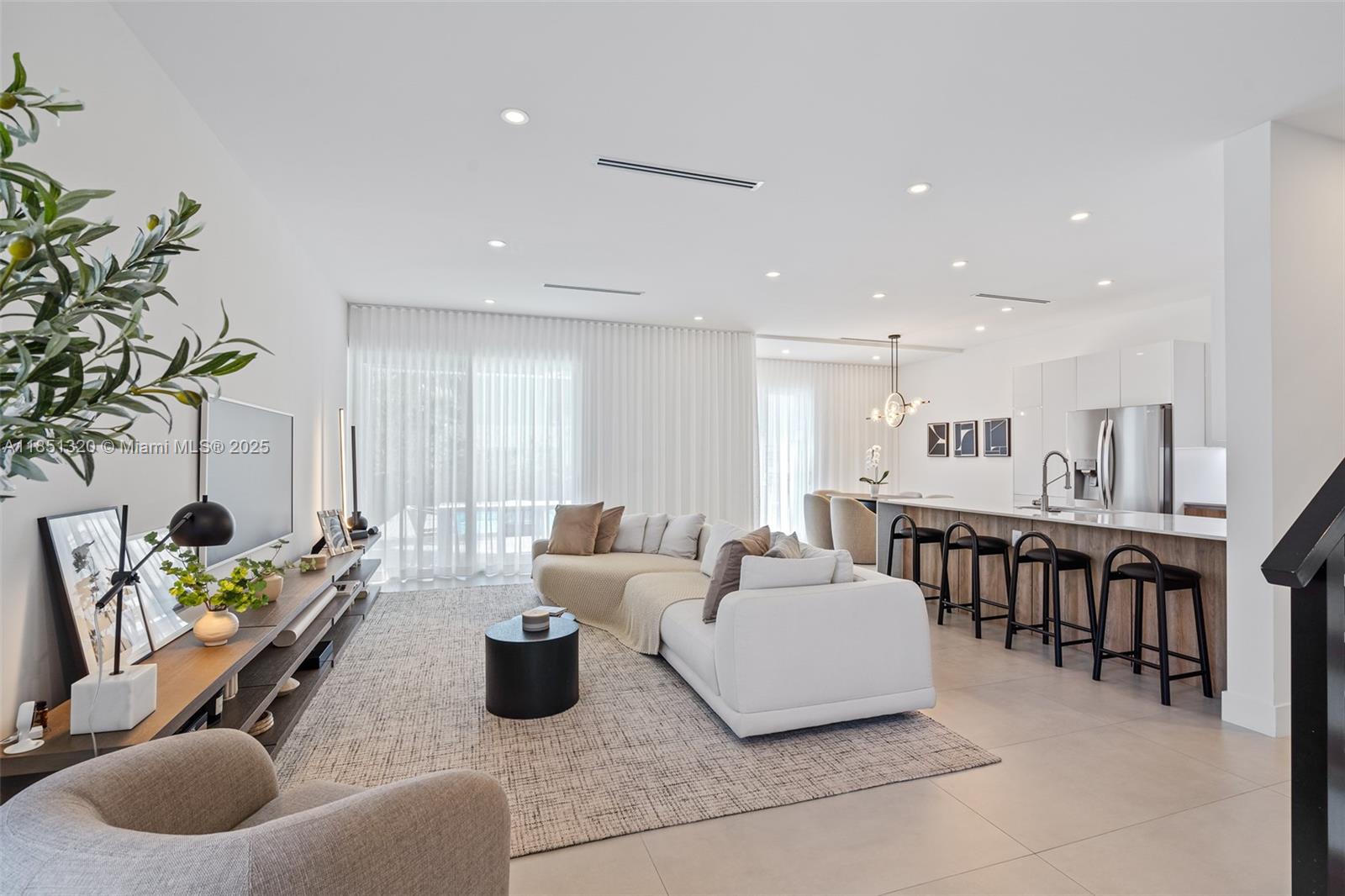 NO HOA in this immaculate, pristine 3-beds, 4-full baths corner townhouse where all bedrooms feature ensuite baths offering unmatched privacy! Built in 2023, with split-bed layout, soaring ceilings, quartz kitchen, impact-rated windows and designer finishes throughout. The primary suite includes a newly installed custom-made oversized walk-in closet, dual vanities, spa-style glass-door shower, and a private balcony overlooking the pool, perfect for morning coffee. Two car garage with additional parking in the driveway. Located in Santa Barbara Estates, just minutes to Pompano Beach, I-95, retail, and restaurants, this turnkey townhouse blends elevated living with ownership freedom. This townhouse delivers one of the most compelling values in the area. Easy to show, schedule a visit today!