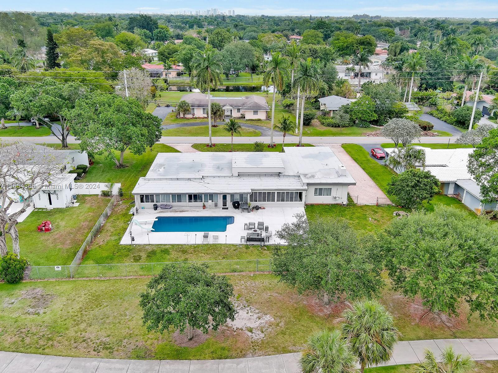 Plantation Golf Estates home sits directly on the golf course w/ incredible sunset views. Estate home features 5 bedrooms, 3 bathrooms, a media/dining room, and an expansive Florida room spanning the entire length of the home, plus a fully furnished 1/1 apartment w/ separate entrance. The apartment can be used as an in-law suite. New gourmet kitchen w/ custom cabinetry, 2020 appliances, and sleek 48" x 48" porcelain tiles. The master bedroom has a large sitting area w/amazing sunset view. Fully renovated bathroom w/ rain & jet spray shower system, steam sauna, and huge his/her custom closet. Newly resurfaced luxury diving pool and deck. New roof 2021. Private intercom & camera security system. 4-stage water filtration system.New central AC (2023) and backup split in each room & Garage.