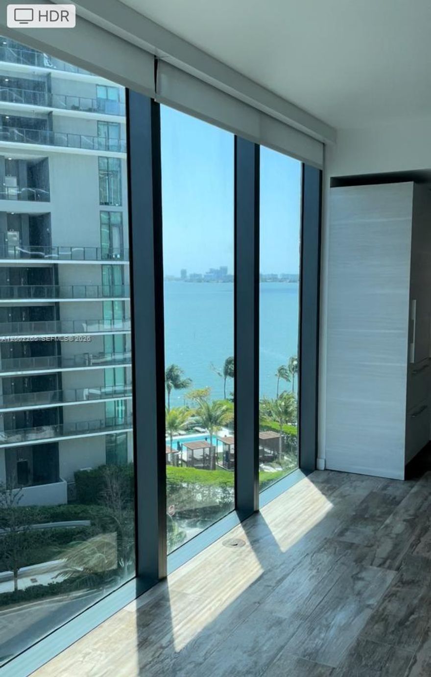 Enjoy waterfront living in Edgewater in this beautifully appointed corner unit featuring 1 bedroom and 1.5 bathrooms at Paraiso Bay. Ideally situated near Brickell, Downtown, Midtown, Wynwood, and the Design District—offering convenient access to everything while maintaining a peaceful, private atmosphere.
The residence boasts breathtaking views of Biscayne Bay and the city skyline, highlighted by floor-to-ceiling windows and a private balcony. Interior features include elegant porcelain tile flooring, a spacious primary bathroom with dual sinks and a soaking tub, and a sleek Italian-designed kitchen with premium appliances. A semi-private foyer adds an extra touch of exclusivity.
Residents enjoy world-class, resort-style amenities, including a private marina, bayfront park, heated pool, jacuzzi and spa, state-of-the-art fitness center, wine room, cigar lounge, private movie theater, business center, and a stylish residents’ lounge with billiards. Additional features include a children’s park and pool, as well as valet service, concierge, and 24-hour security.
The unit includes one assigned parking space, as well as internet and cable. Pet-friendly with deposit. Non-smoking unit. Move-in ready. Available starting May 15.