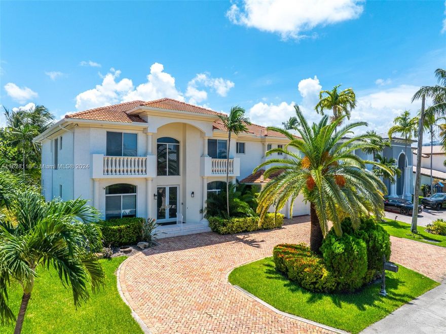 Welcome to an Eastern Shores waterfront dream home, perfectly located between Aventura, Sunny Isles, and Bal Harbour in the heart of South Florida. Built in 2001, this stunning home boasts massive ceilings, spacious rooms, and a great family floor plan. The chef's kitchen opens to the family room, perfect for daily living. The formal dining room, right off the great room, makes entertaining a breeze. The backyard faces southeast, ensuring perfect sunshine for your pool. Enjoy ocean access with no fixed bridges and views of beautiful homes. Experience the best of Eastern Shores living!