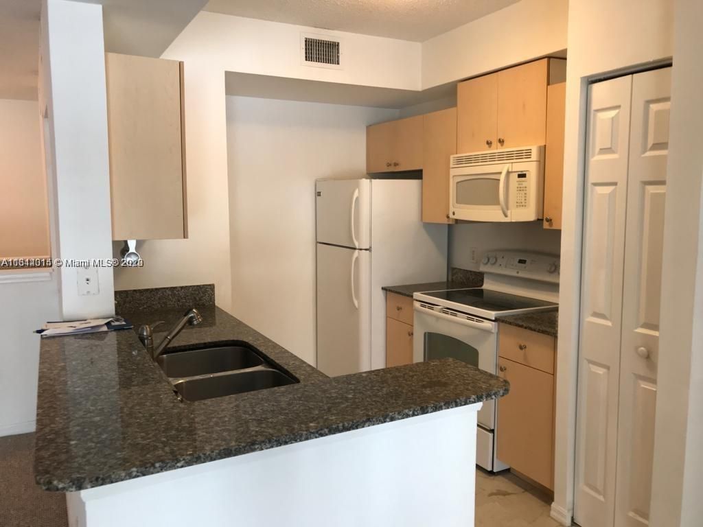 Photo of 2442 Centergate Dr #204, Miramar, FL 33025 (MLS # A11344014)