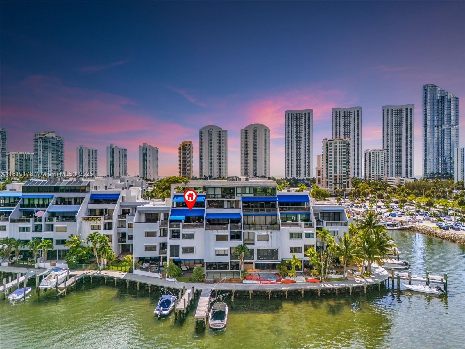 Waterfront Living on Poinciana Island. Live the resort lifestyle in this rarely available 3-bed, 2.5-bath two-level condo on the exclusive, guard-gated Poinciana Island in Sunny Isles Beach. Surrounded by water, this private island offers scenic walking paths around the entire dock, 24/7 security, and two tennis courts just steps from your door. Enjoy expansive Intracoastal and park views from your private terraces. The home features high ceilings, an open layout, modern finishes, and a large kitchen perfect for hosting. The primary suite includes an en suite spa bath, while the spacious split-level floor plan adds privacy and versatility. Located minutes from the beach, Bal Harbour, and Aventura, this is your chance to own a piece of paradise.