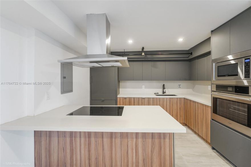 Discover a tropical oasis in the heart of Miami, just moments from everything the city has to offer. This stunningly renovated 2-bed, 2-bath condo in Quayside boasts high-end finishes, custom built-ins, walk-in closets, and brand-new impact windows and sliding glass doors. Enjoy breathtaking views from your private retreat in this serene 32+ acre resort-style community. All special assessments have been paid in full, making this a smart investment in a rapidly growing area. Quayside offers unparalleled amenities, including lush landscapes, walking trails, waterfalls, 8 tennis courts, a top-of-the-line gym, heated pools, saunas, hot tubs, a playground, dog park, BBQ area, a marina, a waterfront restaurant, and more. Deeded dock slip available but not included in the sale. A must see!