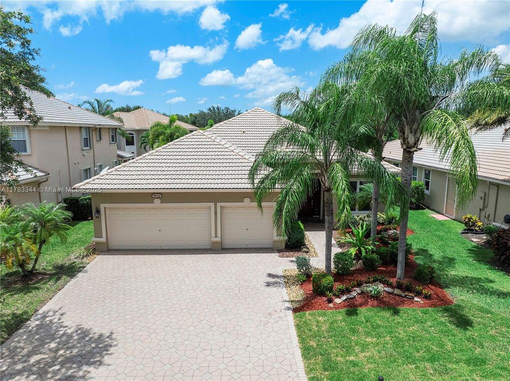 Photo of 6017 NW 56th Circle, Coral Springs, FL 33067 (MLS # A11793344)