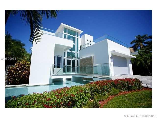 Stunning waterfront estate completely decorated and furnished by world renowned designer STEVEN G, boasts impressive details & finest finishes. 2 story home features 5 bedrooms & 6 full bathrooms, 2 car garage & ramp for 7 more cars. Elegant formal dining room, family room, kitchen with Italian cabinets, two dishwashers, two sinks. Plasma TV in all bedrooms, electric shades & Italian doors. Spacious patios & balconies overlooking the waterway. No expense spared. Bring your most meticulous customer!