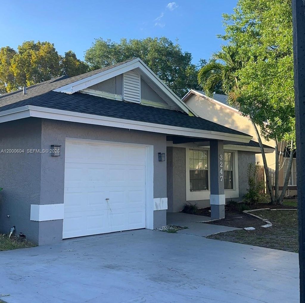 Photo of 3247 NW 123rd Ave, Sunrise, FL 33323 (MLS # A12000604)
