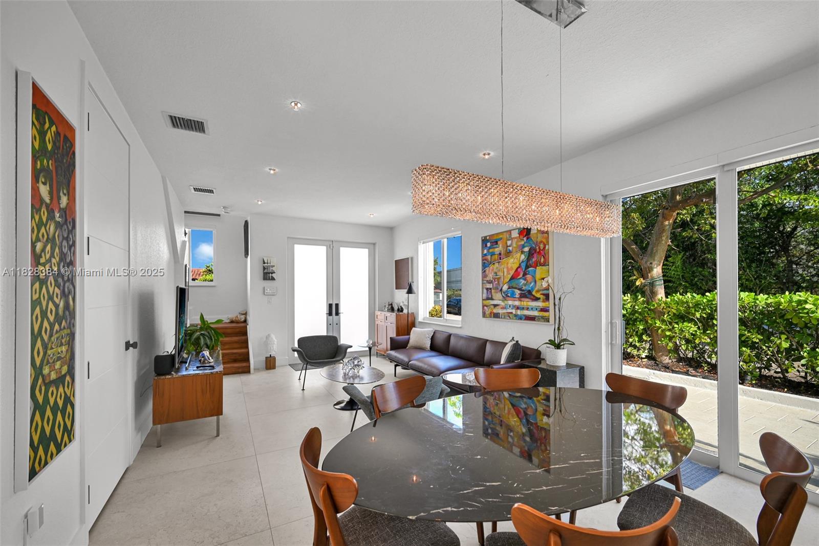 This beautifully updated townhouse is completely move-in ready and offers a perfect blend of style and comfort. The main level features sleek tile flooring, while the upstairs boasts warm wood floors that add a touch of elegance. The kitchen has been tastefully renovated with modern cabinetry, countertops, and stainless steel appliances, and the bathrooms have been fully updated with contemporary finishes. With a functional layout, bright living spaces, and thoughtful upgrades throughout, this home is ideal for anyone looking for a turnkey property. Located just minutes from the highly anticipated MIAMI FREEDOM PARK.