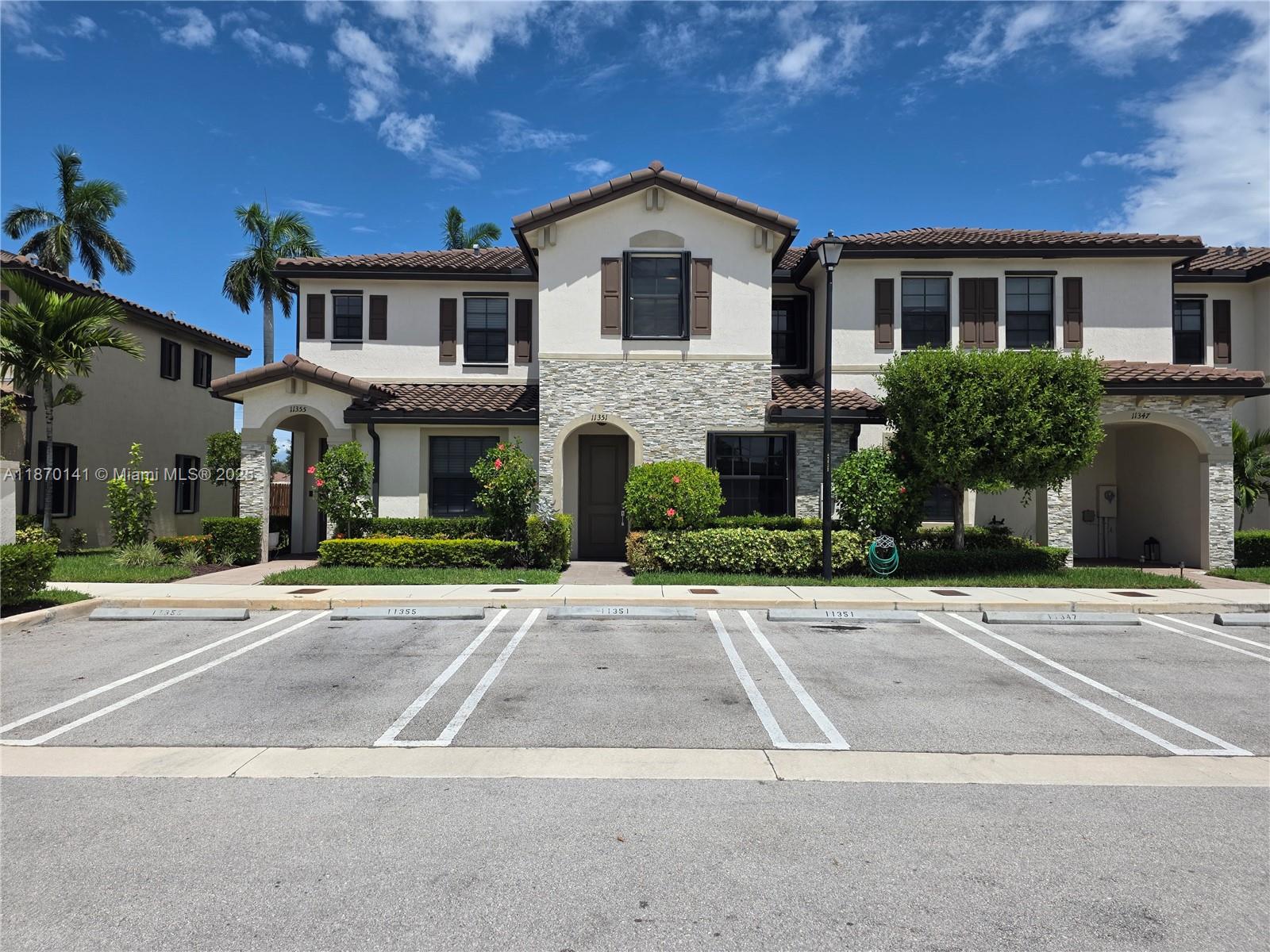 Stunning 3-bedroom, 2.5-bath townhouse in the desirable Coco Palms Villas. Filled with natural light, the home features an inviting foyer, open living and dining areas, and tile floors throughout. The kitchen offers sleek stainless steel appliances and overlooks the spacious family room. Step outside to a fenced covered patio, ideal for outdoor entertainment. Upstairs, the primary suite features a generous closet that also houses a stackable washer and dryer, both conveniently located on the second floor. Two assigned parking spaces are directly in front of the home, with ample guest parking across the street. Residents enjoy a clubhouse, fitness center, pool, dog park, and playground. Conveniently located near major highways with access to Homestead, the Florida Keys, Publix, and schools