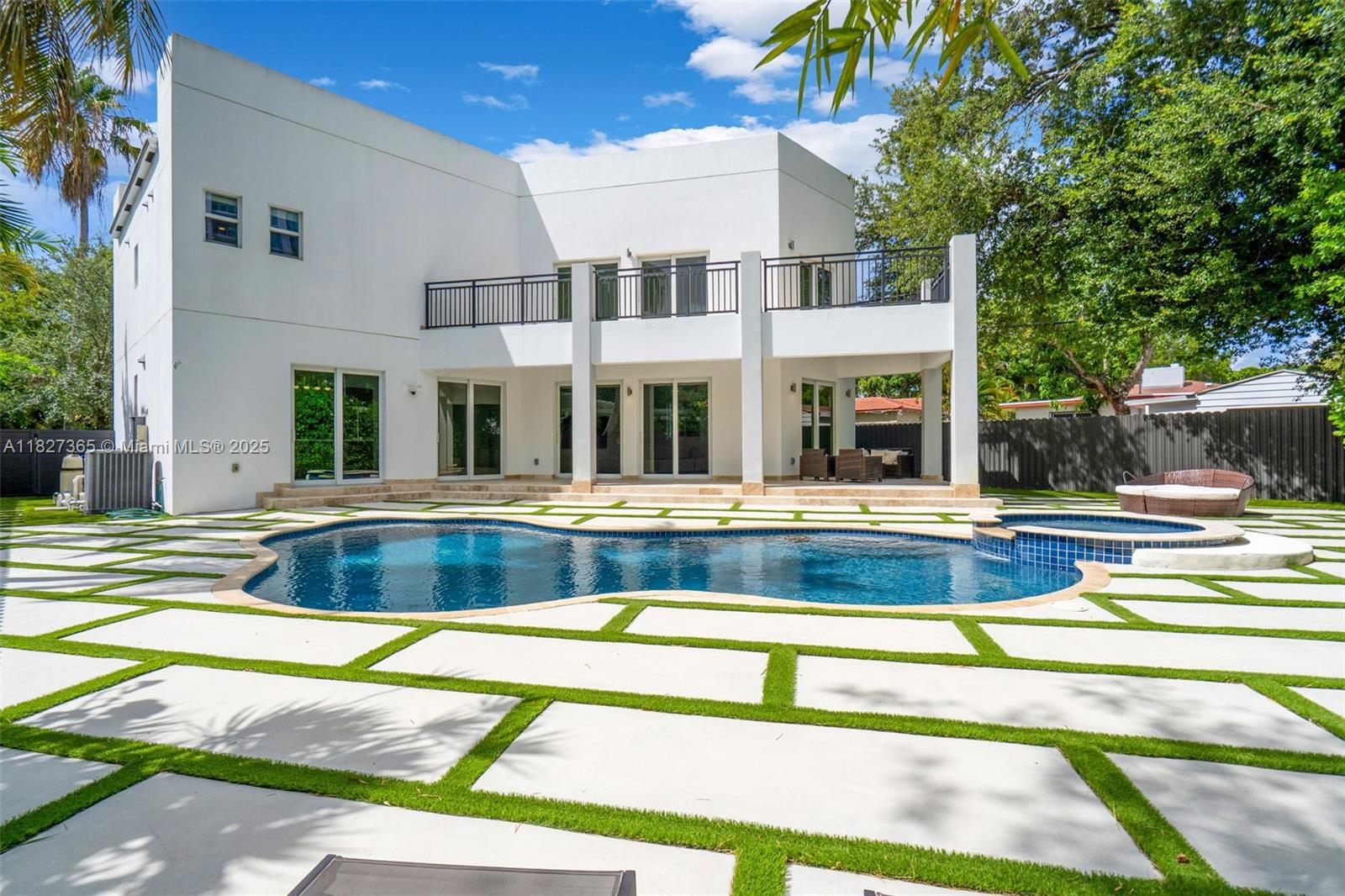 Modern 2-story residence situated in the desirable neighborhood of The Roads. Boasting over 3,000 sqft; 4-bed, 4-bath, featuring an open-concept living and dining, plus a spacious 1-car garage. Expansive primary suite features a huge balcony overlooking the pool, custom walk-in closet, dual vanity sinks, large shower, and a jetted tub. Walk-in closet in each bathroom. Step outside to your lush backyard! Clusia hedges for privacy, heated pool and spa; perfect for year-round enjoyment in the Miami sunshine! Additional features include: motorized roller shades, LIFX smart lighting, impact windows and doors, and aluminum fencing. Unbeatable location! Just off I-95, minutes from Brickell, Key Biscayne, Coconut Grove, US-1, shopping, and dining. Schedule your private your tour!