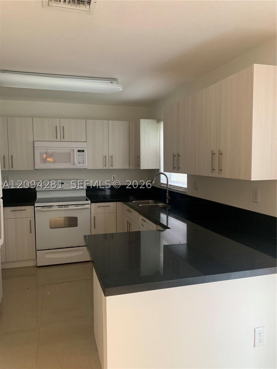 Photo of 17042 NW 22nd St #17042, Pembroke Pines, FL 33028 (MLS # A12094281)