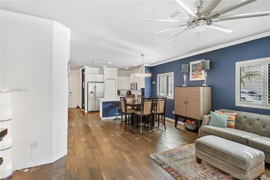 The new year brings an incredible opportunity to own this amazing 3-2 1/2 year young rarely available end unit townhome in an amazing pet/child-friendly community. Perfect for first time home buyers or as a great investment/rental property. Just steps away from the community pool with lake and views right outside your front door. It is located deep into the community far from the bustle of dixie highway. The open floor plan main living area boasts 9' ceilings, crown molding and wood look tile throughout; clean white 36' wood cabinets, granite countertops, and professional grade stainless steel appliances in the kitchen. All energy-efficient lighting and custom Plantation Shutters complete. MOTIVATED SELLERS consider all reasonable offers. Please, 24 hours notice to schedule a showing.