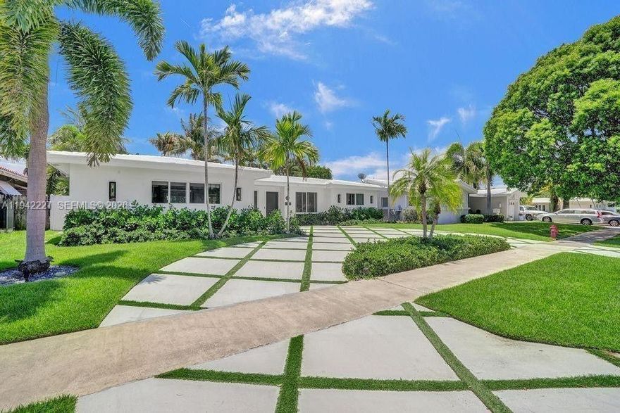 This stunning oasis will transport you to a mid century tropical paradise. This bright 3 bedroom home in Imperial Point offers crisp finishes, open living spaces and is lined with impact windows and doors. The generous floor plan is flooded with natural light and has a renovated kitchen and bathrooms, tile & wood laminate floors & custom lighting. The sun soaked Southern exposure back yard is complete with a sparkling pool that will make you feel like you're on vacation every day. Home also has an EV charger, built-ins in every closet, Built out pantry, laundry room & tankless hot water heater. Amazing location - surrounded with great dining, a few miles to the beach & close to great schools.