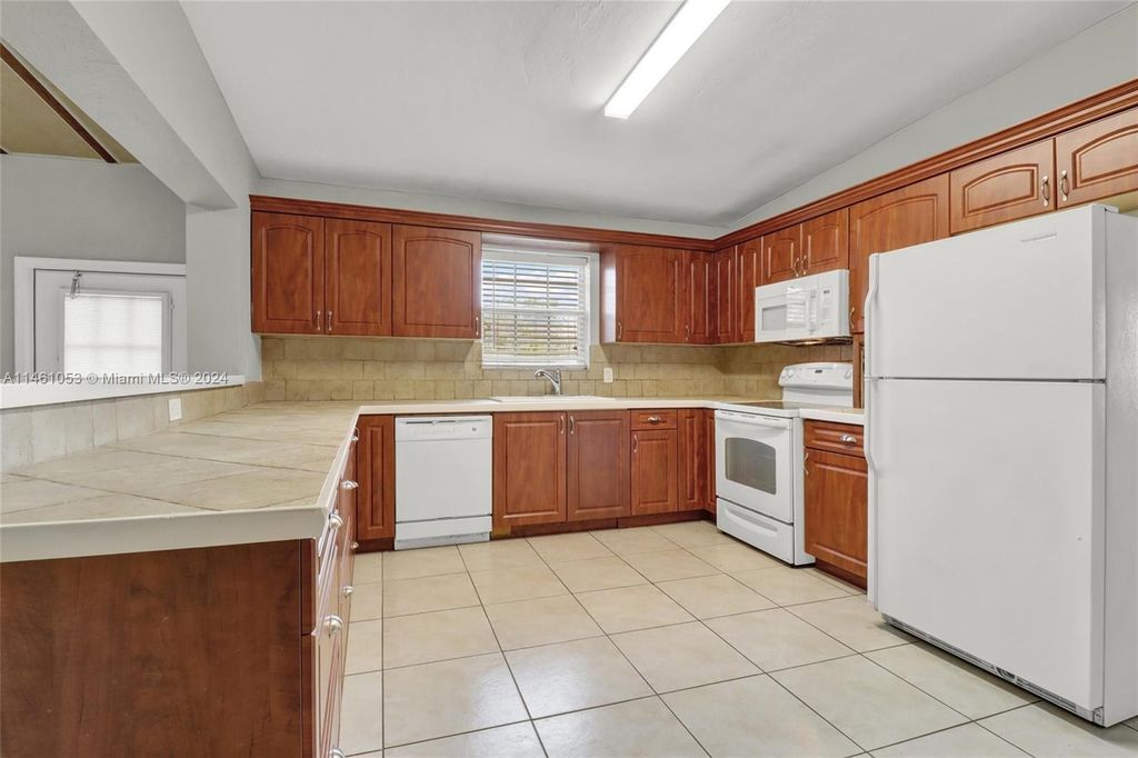 Photo of 5644 Maypop Rd, West Palm Beach, FL 33415 (MLS # A11461053)
