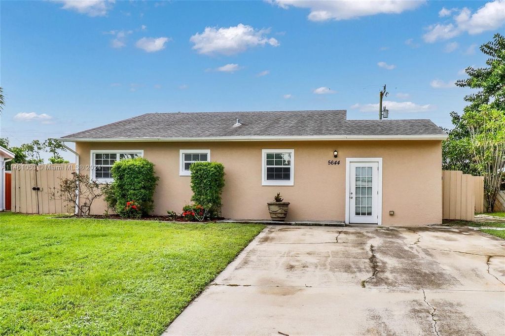 Photo of 5644 Maypop Rd, West Palm Beach, FL 33415 (MLS # A11461053)