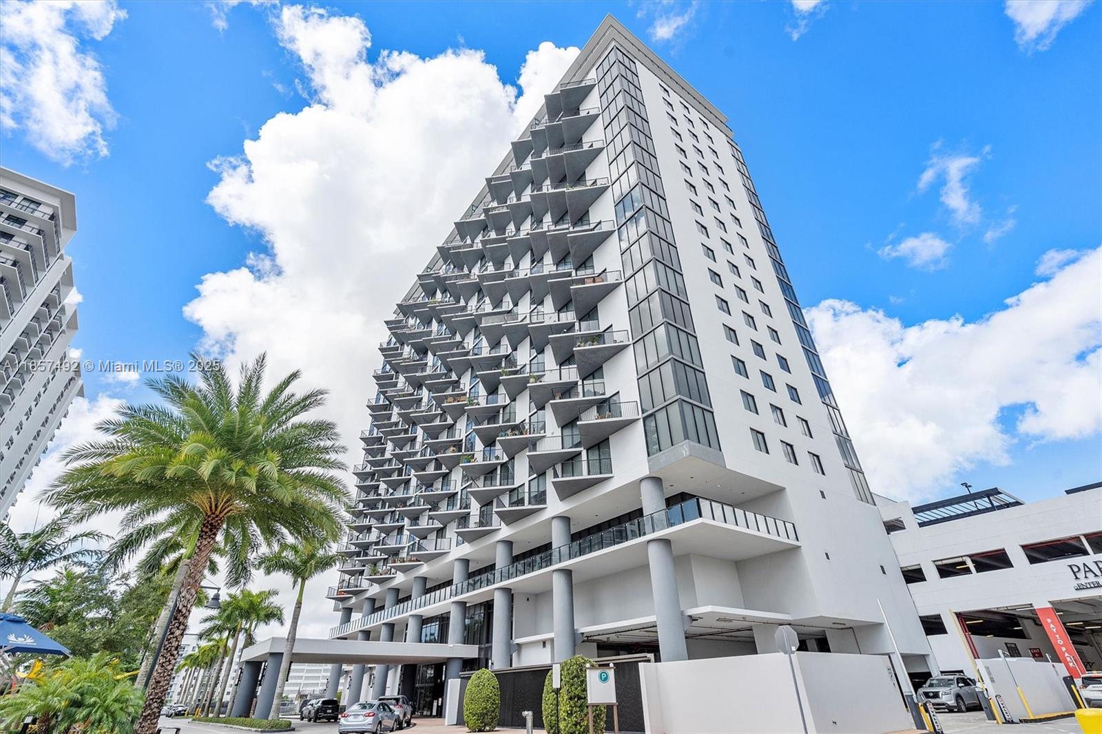 5252 Paseo at Downtown Doral, offering resort-style amenities within the building. Clean and impeccable, 12 floor, great views with two balconies, one for the social area, and other in the master bedroom. Impact windows, custom blinds, stainless steel appliances and beautiful and open kitchen area. Modern club house, stunning pool with cabanas, great party room, etc. HOA includes water services, Include Internet and cable 24/7Concierge/Security and valet parking as well.
