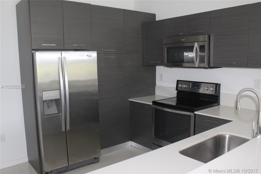 Just freshly painted, Beautiful townhome in secure gated community, with pool and basketball court. Enjoy the view of your private lake from your living room. Newly constructed unit features Italian designed cabinets, stainless steel appliances, porcelain marble flooring, washer/dryer and attached automatic garage. Great landlord.