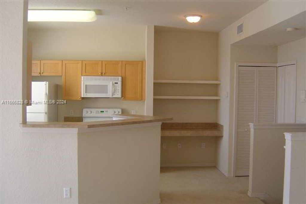 Photo of 11041 Legacy Blvd #302, Palm Beach Gardens, FL 33410 (MLS # A11666828)