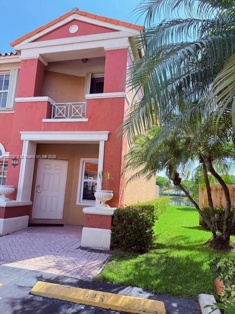 Great opportunity to own a beautiful corner townhome with lake views in The Gates at Doral!. This beautiful and spacious two-story residence offers an inviting open layout with abundant natural light. Enjoy a modern kitchen featuring a large granite island—perfect for cooking and entertaining. Step outside to a generous private patio with serene lake views, ideal for relaxing or hosting gatherings. Convenience is key, with an assigned parking space right in front of the unit, plus ample guest parking for your visitors. The Gates is a secure gated community offering a fantastic, convenient location close to schools, Parks, local shops, supermarkets, shopping centers, and restaurants. Close to FL Turnpike and 10 miles to Miami International Airport. Don’t miss out on this lovely home!