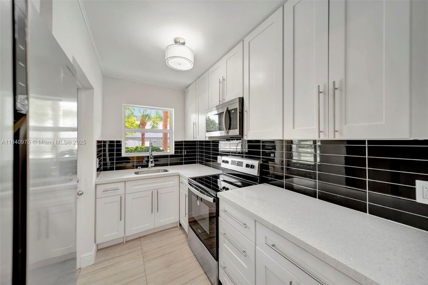 Opportunity knocks to own a rarely available 2Br/2Ba first floor, beautiful and completely remodeled condo in Hallandale Beach. INVESTORS DREAM, no rental restrictions, ALL AGES. Nicest, move in ready unit in all ages Paradise by the Sea w/ high impact windows & doors. This unit features an upgraded kitchen w/ quartz countertops, white shaker cabinetry and brand new SS appliances. Spacious master bedroom w/his and hers closets and ensuite updated bathroom w/shower. Laminated floors throughout. Screened porch overlooking the pool. Amazing location: just a short walk  to the beach, restaurants, coffee shops. Gulfstream Park and Aventura Mall are merely brief drive away. Amenities include pool, clubhouse, park w/BBQ grills and laundry room on each floor. Make it yours TODAY!!!!